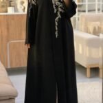 Black luxury abaya with white floral embroidery from Abaya Dubai One modest fashion collection
