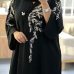 Black luxury abaya with white floral embroidery from Abaya Dubai One modest fashion collection