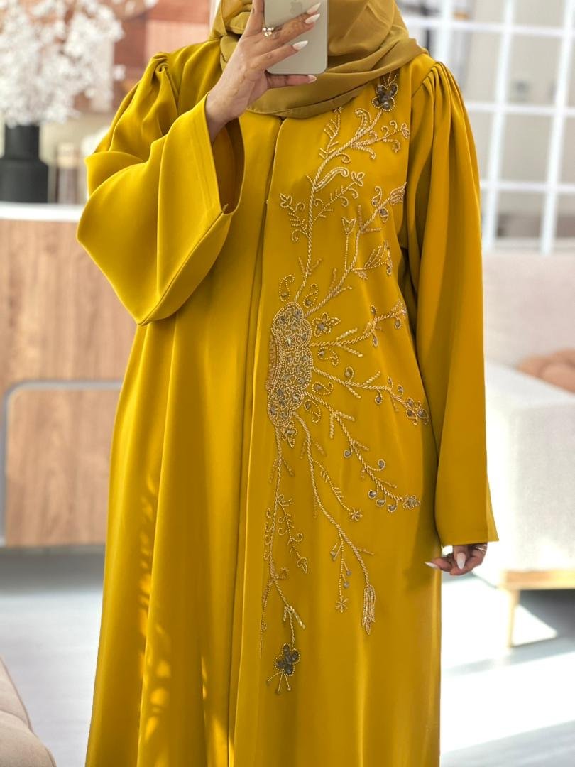 Golden yellow abaya made from high premium Barbie fabric with elegant hand-beaded floral embroidery, perfect for Eid and special occasions.