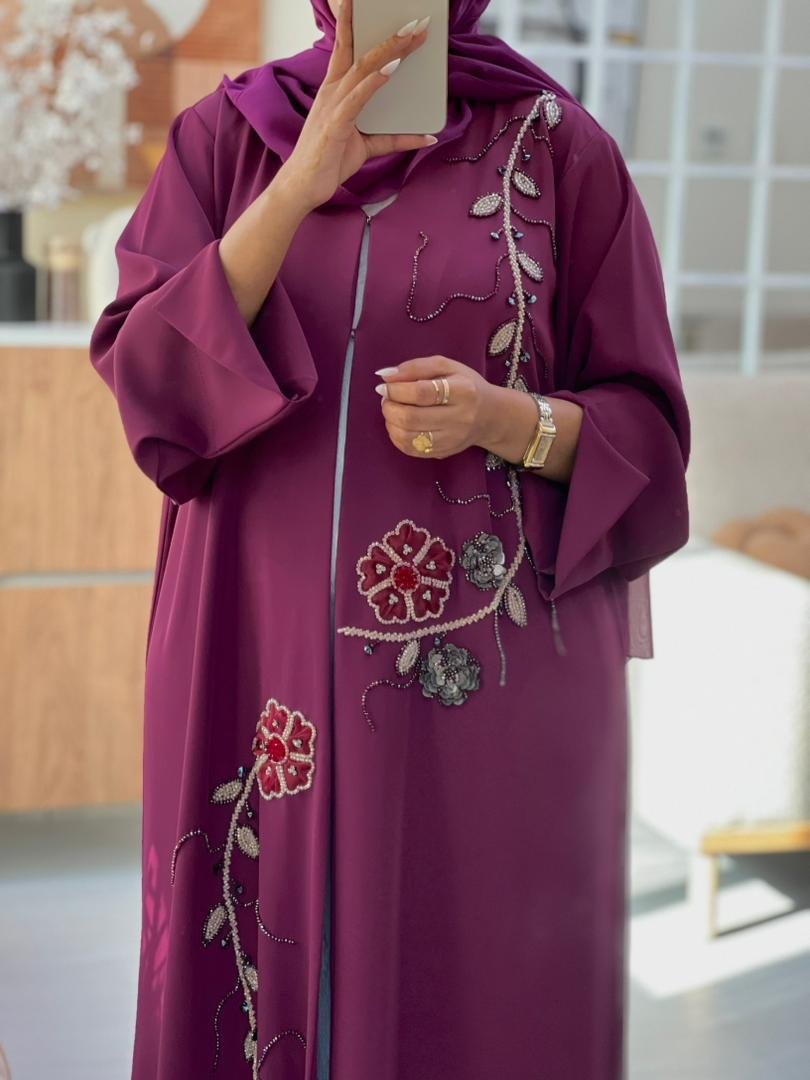 Elegant purple abaya with hand-beaded floral embroidery and 3D flower embellishments, perfect for Eid and special occasions.